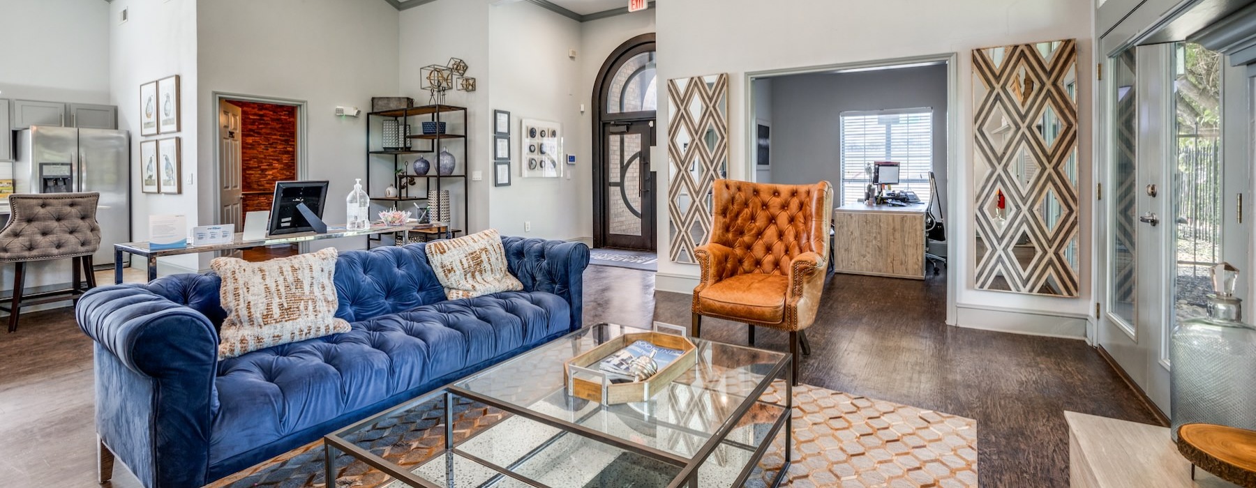 a clubroom with a couch, a chair and a coffee table