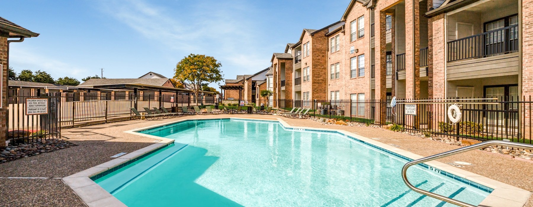 a swimming pool in front of a building