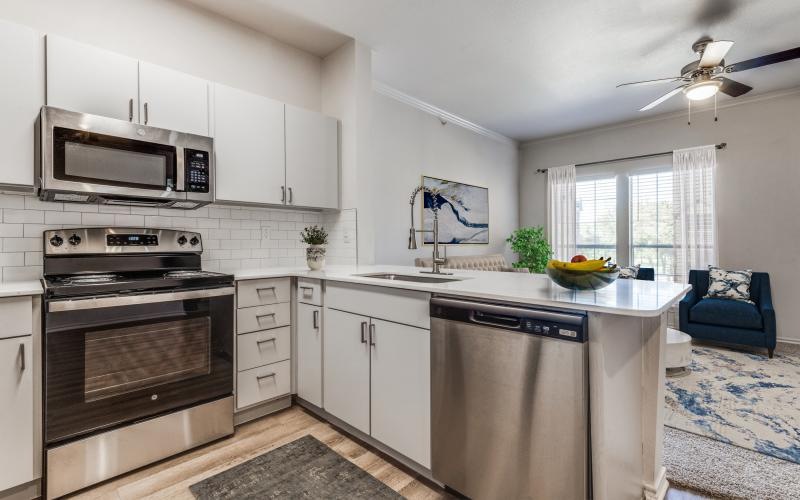 a kitchen with white cabinets