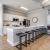 a kitchen with a table and chairs