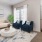 a living room with a couch and a fan
