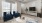 a living room with a blue couch and a television