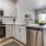 a kitchen with white cabinets