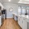 a kitchen with white cabinets