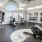 a room with a few treadmills and a large window