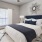 a bedroom with a bed and a fan