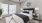 a bedroom with a bed and a fan
